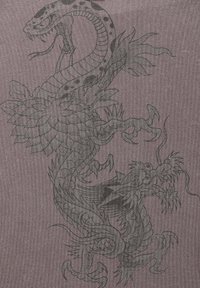 Textile featuring a black and grey illustration of a snake and dragon entwined around a flower, on a textured purple background.
