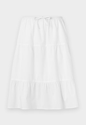 Bela bombažna krila z elastičnim pasom, slojevitimi volančki in tekočim dizajnom. Gladka tekstura, dolžina do gležnjev.