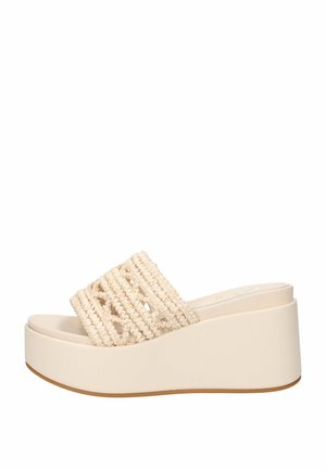 Sandalo beige con zeppa platform, cinturino superiore intrecciato e suola spessa liscia, punta aperta e design slip-on.