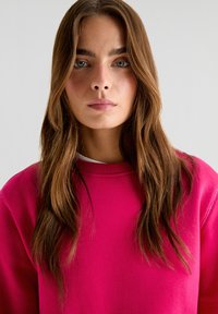Scalpers Sweater - fucsia