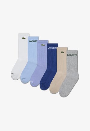 Set van zes geribbelde katoenen sokken in wit, lichtblauw, mauve, donkerblauw, beige en grijs. Elke sok heeft het Lacoste-logo.