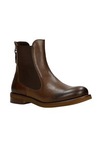 Stivale Chelsea in pelle marrone con pannelli elastici ai lati, punta arrotondata e tacco basso a forma di blocco. Texture liscia con una leggera lucentezza.