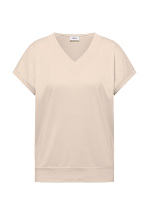 Beige kortærmet top med V-halskrave og opklemmede ærmer, der har en lige kant og glat stoftekstur.