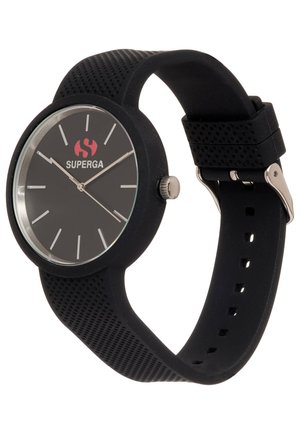 Black silicone watch with a round face, silver accents, and distinct hour markers. Features a textured strap and a logo in red.