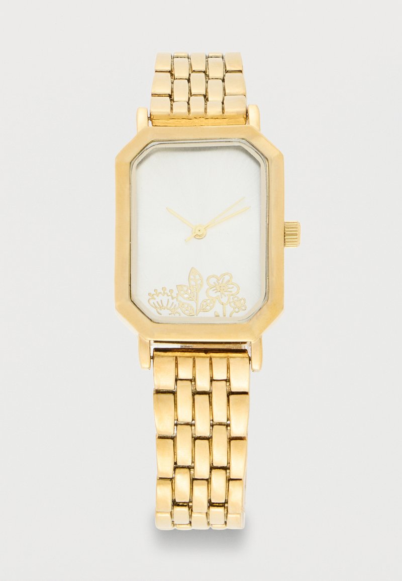 Gold-tone wristwatch with rectangular face, thin hands, and floral design at the bottom on a linked metal band.