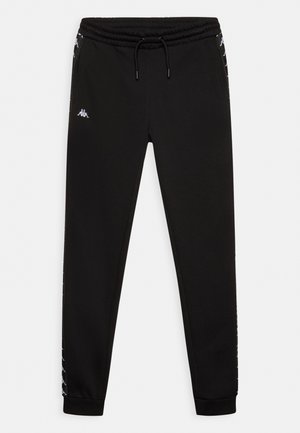 Black tapered sweatpants with elastic waistband and drawstring, featuring white logo pattern down the sides and a small white logo on the left thigh.