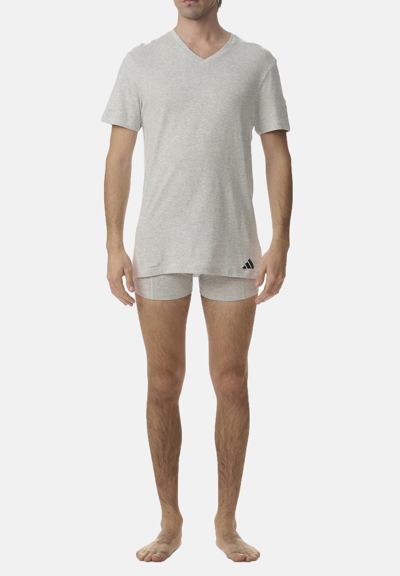 Gray v-neck t-shirt made of soft fabric, paired with light gray boxer shorts. Includes subtle black Adidas logo on the shirt.