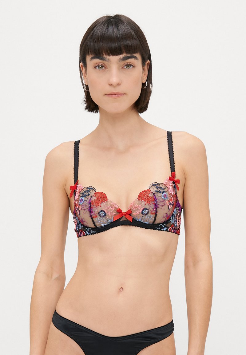 Sostenes de encaje negro con bordado floral multicolor, incluye lazos rojos, copas transparentes y tirantes ajustables. Diseñado con bordes festoneados.