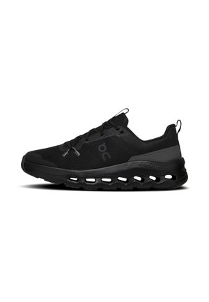 Black low-top running shoe with mesh upper, lace closure, cushioned sole featuring cut-out designs, and pull tabs on tongue and heel.