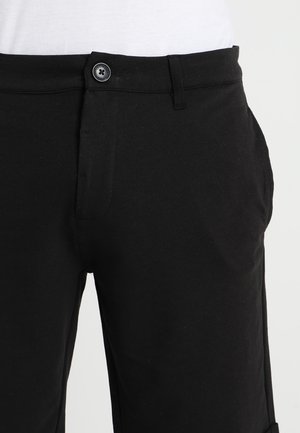 Pantalones deportivos - black