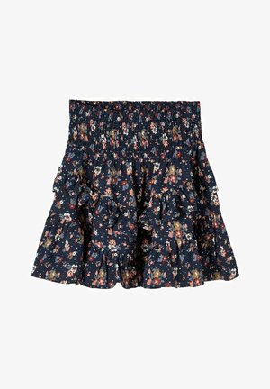 Jupe fleurie bleu marine avec taille smockée et couches à volants à étages, ornée de petites fleurs rouges, blanches, roses et moutarde.