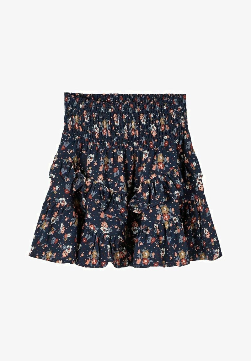 Jupe fleurie bleu marine avec taille smockée et couches à volants à étages, ornée de petites fleurs rouges, blanches, roses et moutarde.