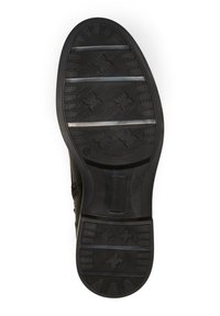 Suola di scarpa in gomma nera con superficie testurizzata, caratterizzata da scanalature orizzontali e un motivo decorativo. Logo circolare sul lato.