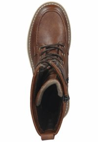 Bottines en cuir brun avec un orteil arrondi, un laçage à l'avant, un col rembourré et une fermeture éclair sur le côté. Semelle en caoutchouc avec des accentuations cousues.