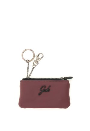 Piccola custodia bordeaux con zip, anello portachiavi e clip in metallo, con logo nero "Gabs" sul davanti.