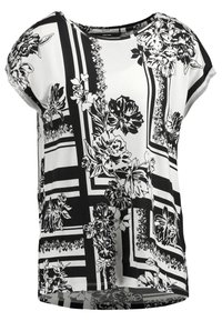 Kortärmad blus i svart och vitt med blommönster och geometriska ränder, tillverkad av lättviktig tyg med avslappnad passform.