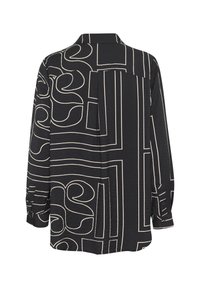 Mustatoon must shirt, mille tekstuuriga kangas, millel on julge koorekastme abstraktne muster. Sisaldab teravat kraed ja pikki varrukaid.