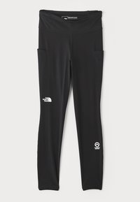 Leggings de sport noirs avec une large taille, deux poches latérales et des logos sur la cuisse et la cheville. Fabriqués en tissu extensible et lisse.