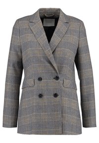 Blazer croisé en tissu gris avec un motif à carreaux noir et or. Il présente des revers à encoches et deux poches avant.