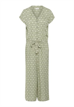 Combinaison à manches courtes en tissu vert clair avec un motif abstrait blanc. Dotée d'un décolleté croisé et d'une ceinture à nouer à la taille.