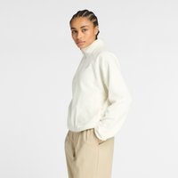 White fleece pullover with a zippered collar and textured finish, paired with beige trousers. Features subtle logo embroidery on the chest.