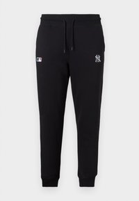 Pantaloni de trening negri dintr-un amestec de bumbac, cu un tiv elastic la talie cu șnur, manșete ribbate și logo brodat pe piciorul stâng.