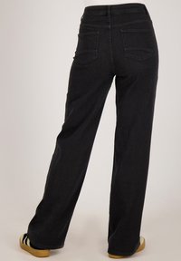 Zwarte wijde jeans van denim, met een hoge taille, twee achterzakken en een nette afwerking zonder versieringen.