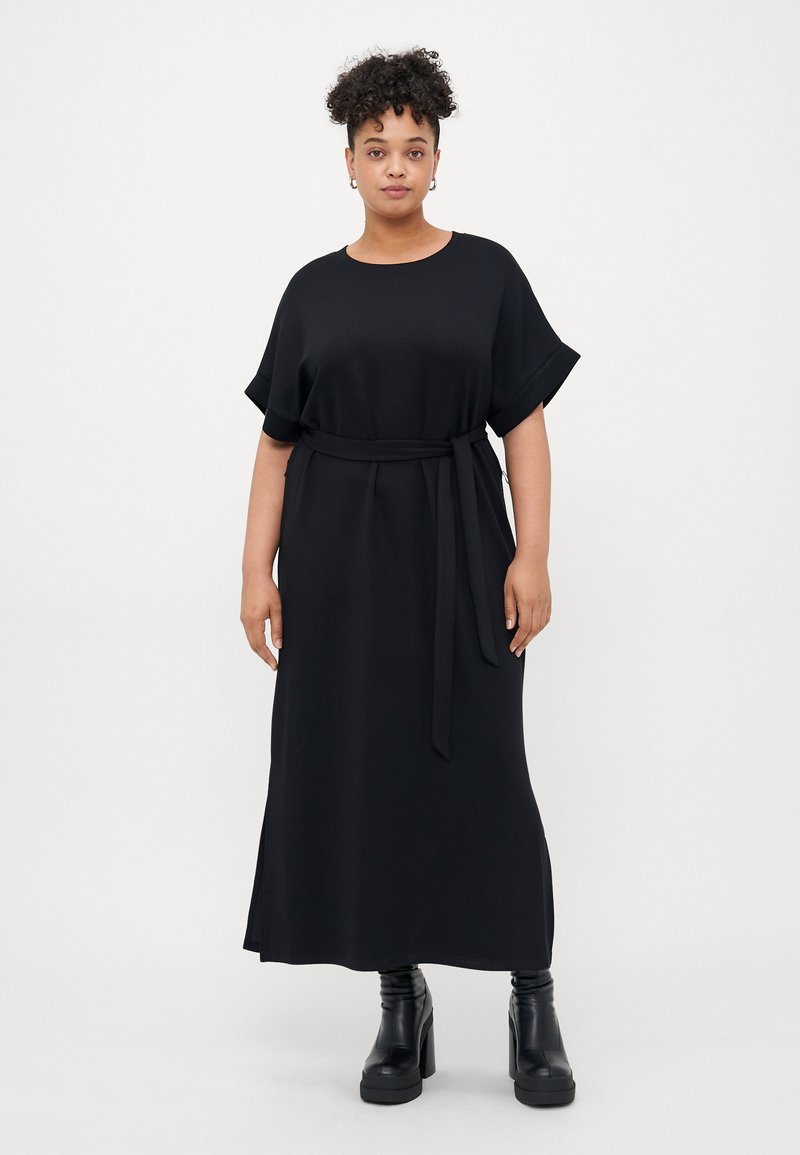 Black maxi dress with short sleeves, featuring a round neckline and a fabric belt at the waist. Smooth texture with a relaxed fit.