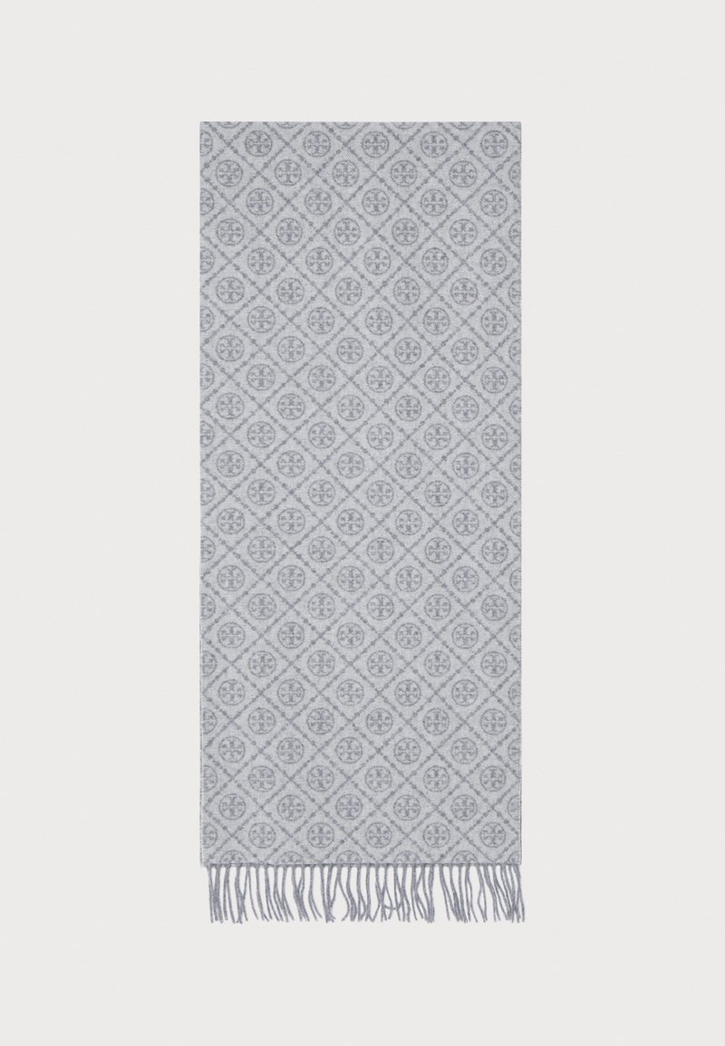 Écharpe grise tissée avec un motif en diamant complexe, présentant des motifs circulaires et des bords frangés. Texture douce et design léger.