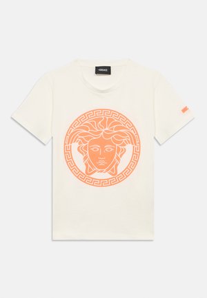 Cream-colored cotton t-shirt featuring an orange Medusa graphic and a Greek key border. Short sleeves, crew neck, and Versace tag on the collar.