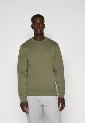 Olive green sweatshirt with a ribbed crew neck and long sleeves, made from soft fabric. Paired with light gray sweatpants.