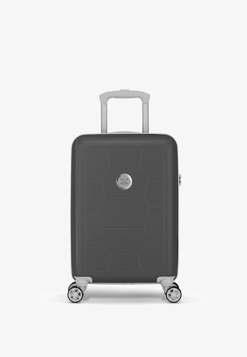 Hard-shell suitcase in dark gray with a geometric pattern, featuring a retractable handle and four swivel wheels for easy mobility.