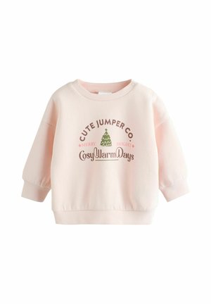 Vaaleanpunainen huppari, jossa on ribbaatut hihansuut ja helma. Keskellä on teksti "Cute Jumper Co. Merry Bright" ja vihreä puugrafiikka.