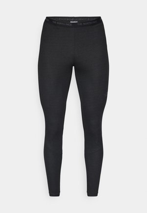 Zwarte leggings van rekbaar materiaal, met een brede tailleband waarop het logo "THE NORTH FACE" is afgebeeld, en een aansluitende pasvorm zonder zichtbare naden.