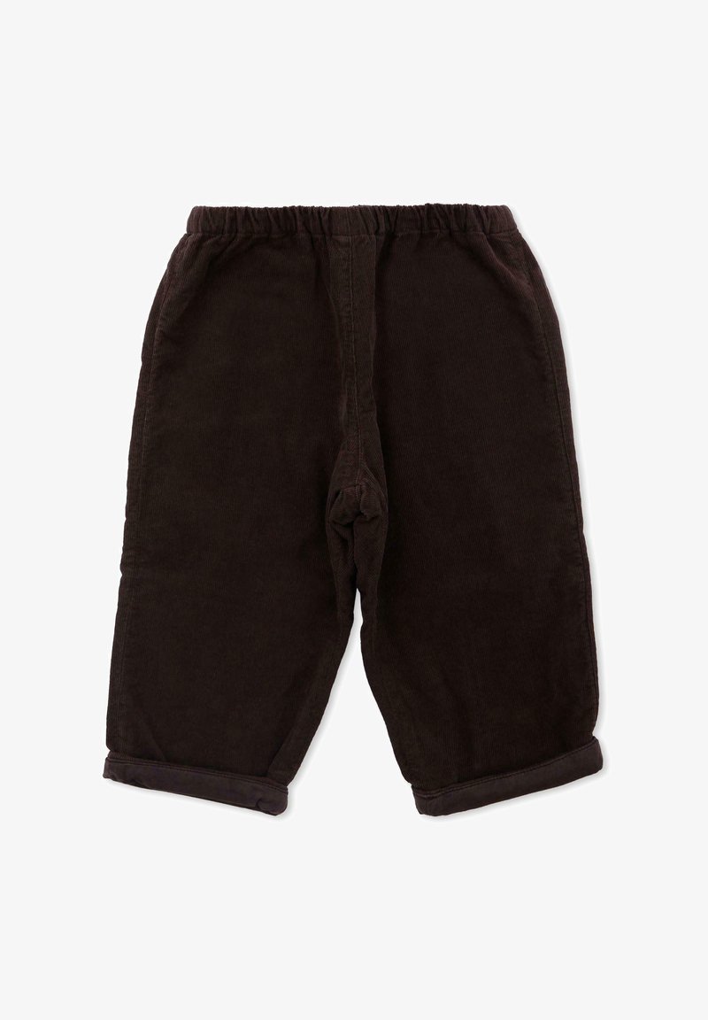 Pantaloni di cotone a coste marrone scuro con vita elastica, lunghezza cropped e orli arrotolati. La texture è a coste, offrendo una sensazione morbida.