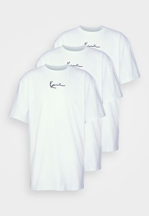 Three white cotton t-shirts displayed front-facing. Each features a black cursive logo on the left chest area. Short sleeves and crew neck.
