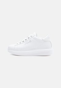 White leather sneakers with a rubber sole, round toe, flat laces, and subtle logo detailing on the side and back. Smooth texture.