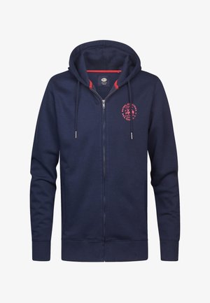 Navy zip-up hoodie with red accents, kangaroo pockets, and a circular logo on the chest. Made from soft, textured fabric.