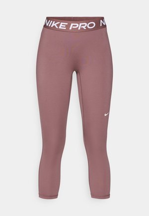 Nike Pro Capri-Leggings in staubigem Mauve. Hergestellt aus dehnbarem Stoff mit glatter Textur, ausgestattet mit einem weißen, gebrandeten Bund und Logodetails.