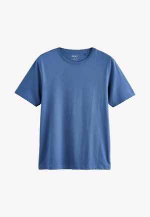 Camiseta de algodón de color azul de manga corta, con un cuello redondo y una textura suave. Sin patrones ni adornos visibles.