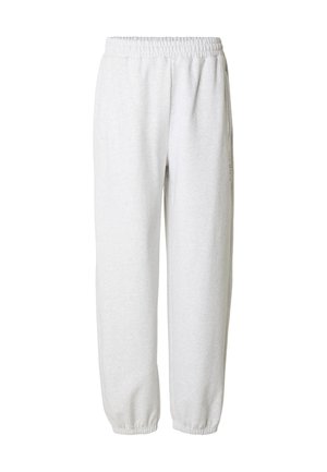 Pantaloni della tuta grigio chiaro in tessuto morbido, con elastico in vita, tasche laterali e polsini elasticizzati alle caviglie.