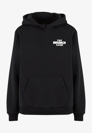 Musternahk kott, mis on valmistatud pehmest kangast, sisaldab ees kangaroo taskut ja valget graafilist teksti "THE BRUNCH CLUB" rinnal.