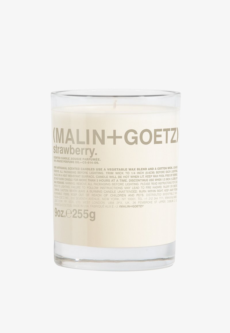 Duftkerze in einem klaren Glasbehälter, gefüllt mit weißem Wachs. Das Etikett zeigt grauen Text mit Marken- und Duftdetails. Fassungsvermögen von 9 oz.