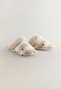 Beige and white checkered slippers with small green tree patterns and a fluffy, soft fur lining around the opening.