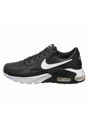 Zapatilla negra con parte superior de cuero, swoosh blanco de Nike, amortiguación Air Max, suela texturizada negra y cordones. Incluye un collar acolchado.