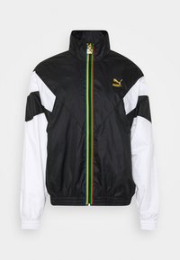 Black and white zip-up jacket with a high collar, featuring a multicolor stripe down the center and a Puma logo in gold.