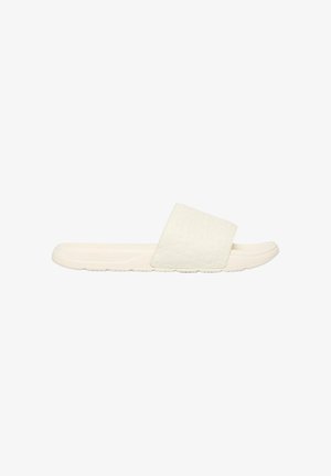 Sandale beige à enfiler avec une large bride texturée et une semelle profilée pour un usage décontracté.