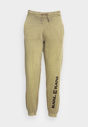 Hellolivgrüne Jogginghose mit elastischem Bund, Kordelzug, Seitentaschen, Bündchen an den Knöcheln und „KARL KANI“-Logo am linken Bein.