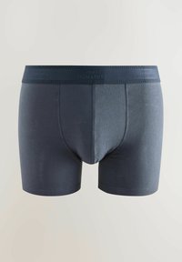 Granatowe męskie figi o bezszwowym kroju, z elastycznym pasem i miękką fakturą, z subtelnym nadrukiem logo na pasie.