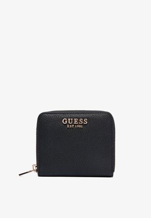 Portafoglio nero con zip completa, texture e logo GUESS dorato con testo "EST 1981" sulla parte anteriore.